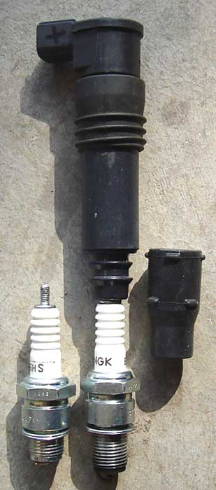 The Spark Plug snaps into the coil itself.